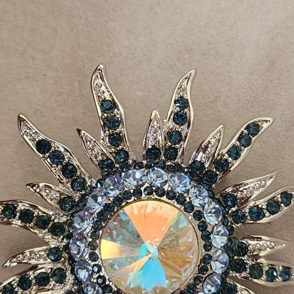 Silver and Blue Starburst Sun Brooch Pin